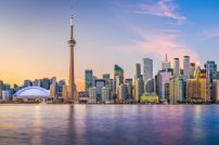 Toronto, Ontario, Canada cityscape on Lake Ontario at dusk. Toronto, Ontario, Canada cityscape on Lake Ontario at dusk.